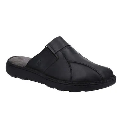 A single black mule shoe is shown against a white background.