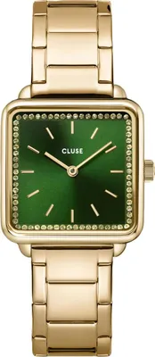 A close-up studio shot of a gold-colored women's watch with a green dial.