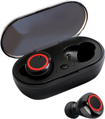 A pair of black wireless earbuds with red accents, shown inside their charging case, with one earbud placed outside the case.