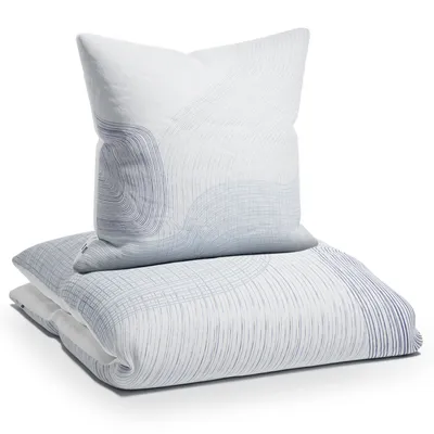 A folded duvet and pillow with a wave-like pattern.