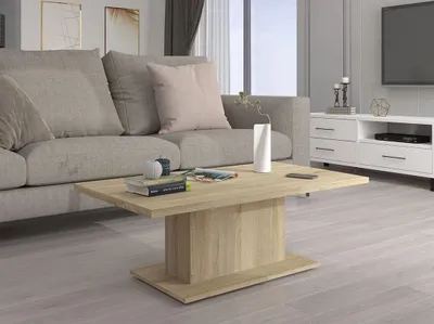 A modern living room with a gray sofa, a wooden coffee table, and a white media console.