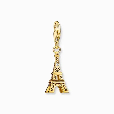 A gold Eiffel Tower charm with a small diamond accent, hanging from a clasp.