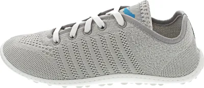 Side view of a gray sneaker.