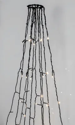 A close-up view of a string of LED lights hanging against a plain background.