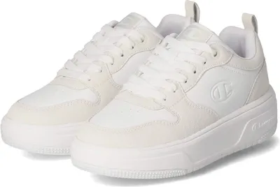 A pair of white Champion low-cut sneakers with a platform sole, shown from a slightly elevated side angle against a white background.