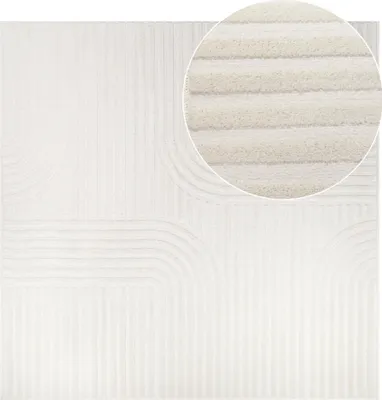 A close-up view of a white rug with a textured ribbed pattern.
