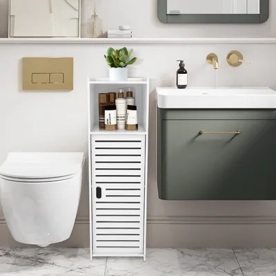 A modern bathroom scene featuring a toilet, a narrow storage cabinet, and a vanity with a sink and faucet.