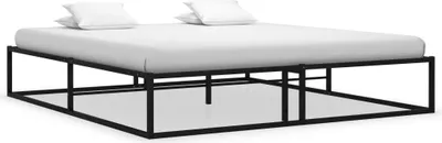 A black metal bed frame with a white mattress and two white pillows.