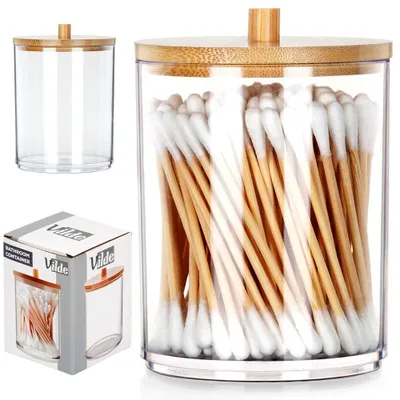 A clear, well-lit product shot of a cotton swab container filled with cotton swabs, accompanied by its packaging and an empty container.
