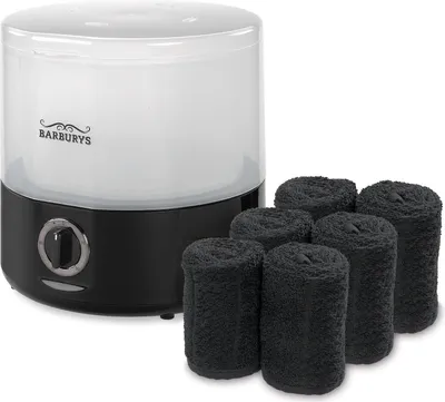 A product shot of a towel steamer and several rolled towels.