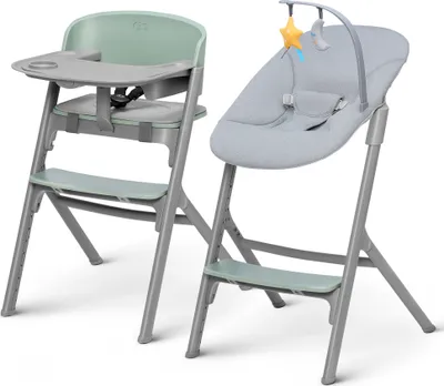 Two baby chairs are shown side by side against a white background. The chair on the left is a high chair with a green seat and tray. The chair on the right is a bouncer seat with a gray cushion and a toy arch with a yellow star and a moon.