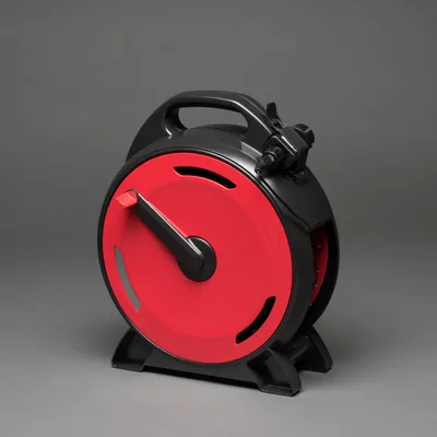 A product shot of a black and red cable reel with a handle against a plain gray background.