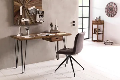 A modern home office setup with a wooden desk and chair.