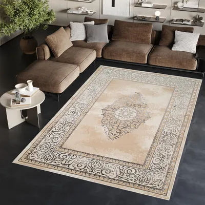 A living room scene with a sectional sofa and a rug.