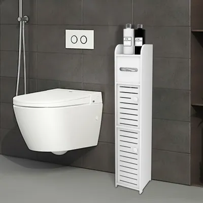 A modern bathroom with a wall-mounted toilet and a narrow white storage cabinet.