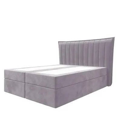 A studio shot of a bed frame with a headboard.