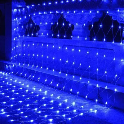A net of blue LED lights draped over a railing and cascading down.