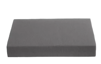 A gray mattress topper on a white background.