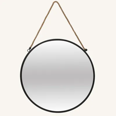 A round mirror with a rope hanger against a light gray background.