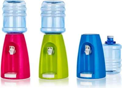 Three mini water dispensers in different colors with water bottles on top, and one extra water bottle on the side.