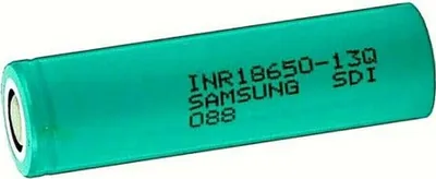 A single green battery with black text printed on it.