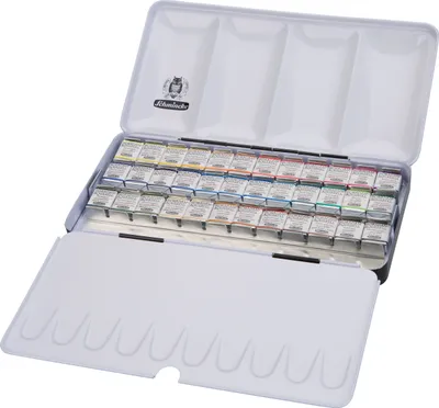 An open metal case of watercolor paints, showing rows of paint pans and a mixing palette on the lid.