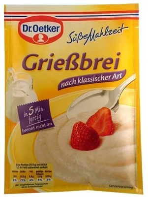 A package of Dr. Oetker Grießbrei (semolina pudding) with strawberries and a spoon.