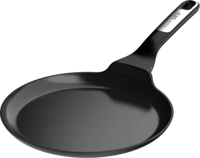 A black frying pan with a silver accent on the handle, shown against a white background.