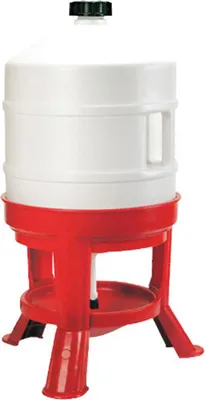 A white plastic poultry drinker with a red stand.