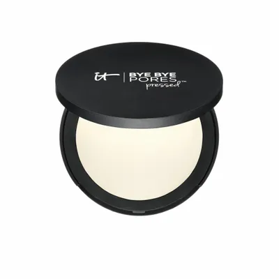 A black compact powder case with the lid open, revealing the powder inside.