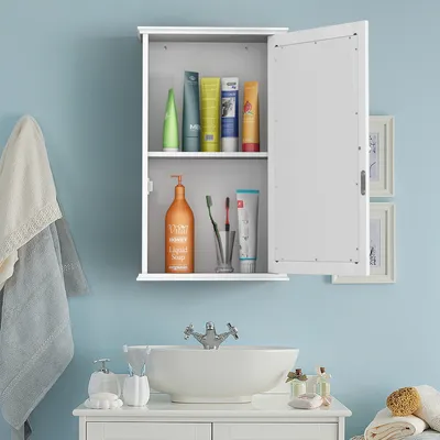 A bathroom scene with a medicine cabinet, sink, and towels.
