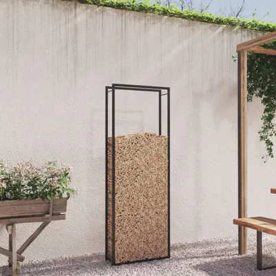 A modern outdoor space with a white wall, gravel ground, and a wooden pergola.