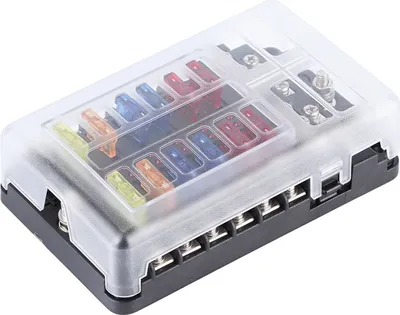 A fuse box with multiple fuses inserted.