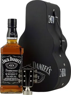 A bottle of Jack Daniel's Tennessee Whiskey and a guitar-shaped case.