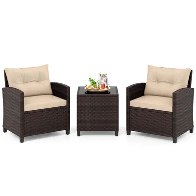 Image de Ensemble de mobilier de jardin COSTWAY en résine tressée, comprenant 3 pièces : un ensemble de mobilier de balcon avec 2 fauteuils, des coussins et une table avec plateau en verre trempé, idéal pour un coin salon résistant aux intempéries pour 2 personnes