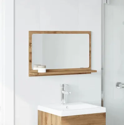 A bathroom mirror with a shelf above a sink and faucet.