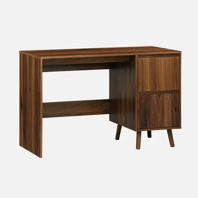 A wooden desk with two drawers and tapered legs, presented against a plain background.