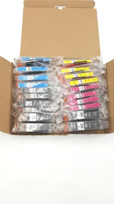 A cardboard box filled with individually packaged ink cartridges.
