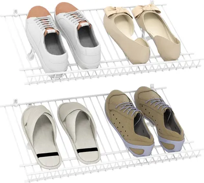A white wire shoe rack with various shoes on it.