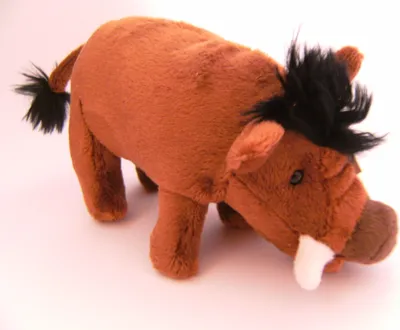 A plush toy warthog is shown from a side angle against a white background.