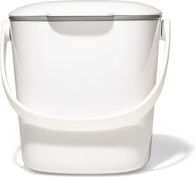 A white kitchen compost bin with a handle and lid, shown against a white background.