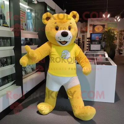Produktbild von Maskottchen REDBROKOLY kostüm des gelben Bären bekleidet mit Laufshorts und Geldbörsen