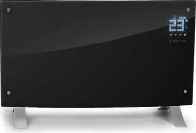 A black glass electric heater with silver legs is shown against a white background. A digital display shows the temperature.