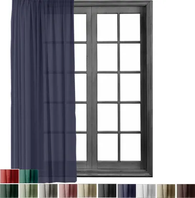 A blue curtain is shown hanging in front of a window with multiple panes.