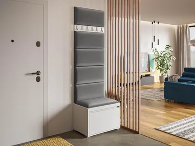 A hallway or entryway with a white door on the left and a modern furniture set on the right, including a shoe cabinet and coat hooks.