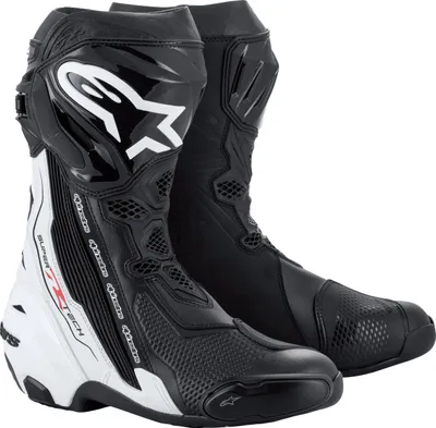 A pair of black and white Alpinestars motorcycle boots.