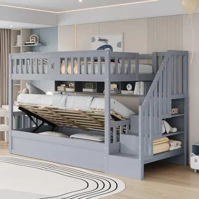 A grey bunk bed with storage and stairs, set up in a child's bedroom.