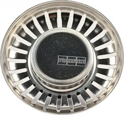A top-down view of a stainless steel sink strainer with the brand name 'FRANKE' visible in the center.