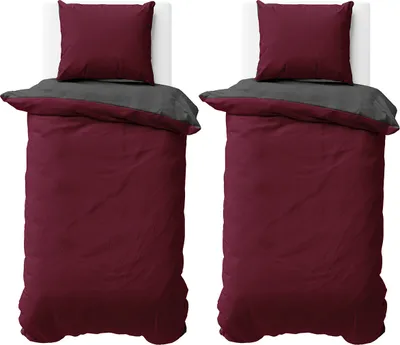 Two identical beds with bedding are shown from a top-down perspective.