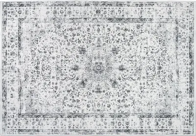 A top-down view of a rectangular rug with a vintage, distressed pattern.